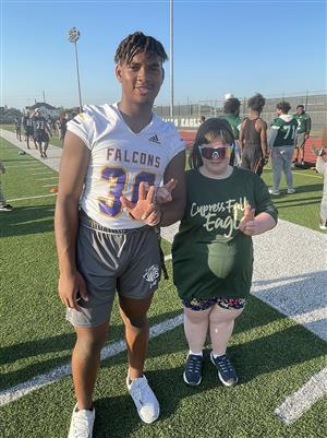 Jersey Village HS football player Malik Slone with Cy Falls student Haley Hayes.